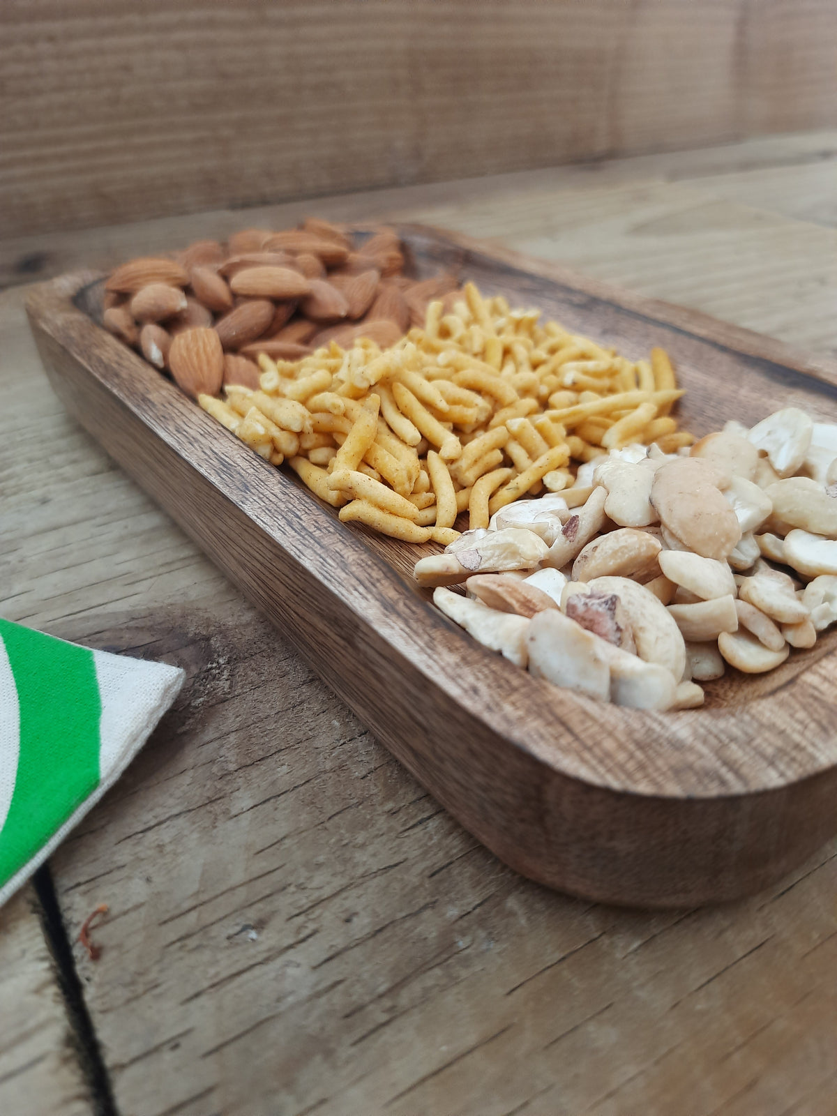 Natural wooden serving tray styled for entertaining