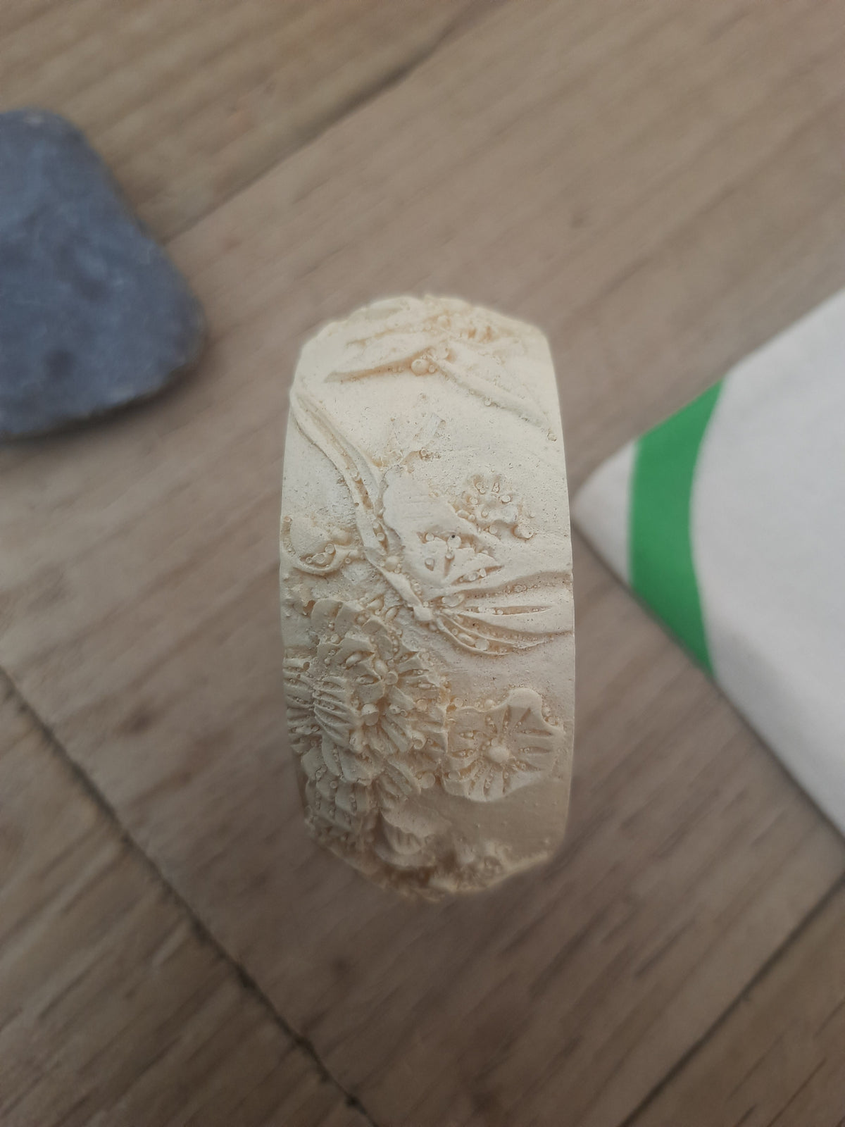 Chunky off-white bangle with a wide profile