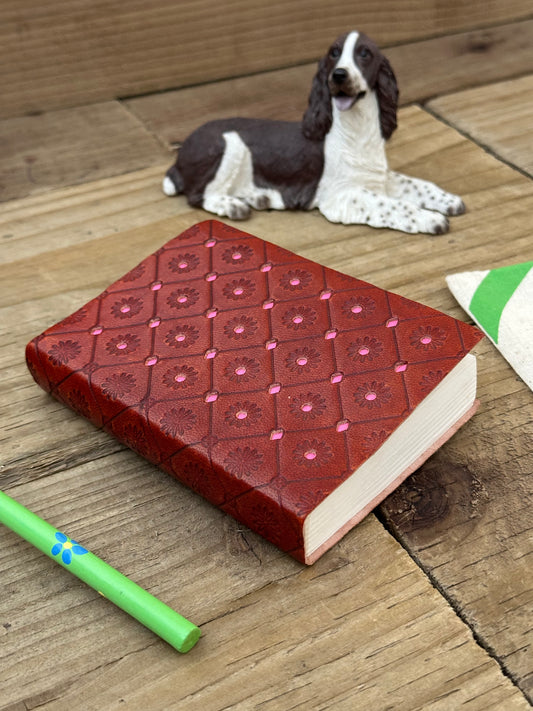 Pink mini leather notebook with embossed decorative cover