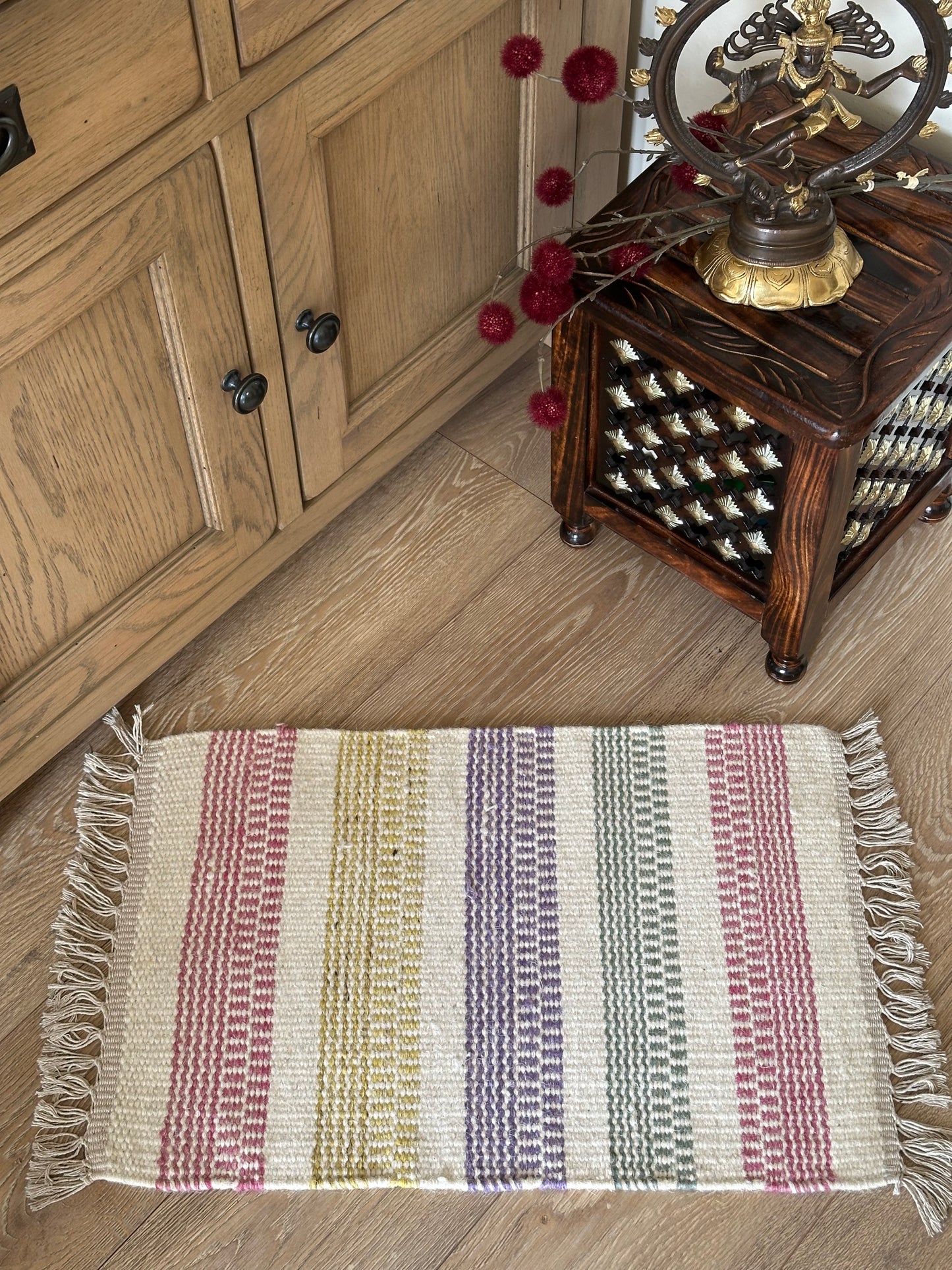 White cotton rug with colourful checked design
