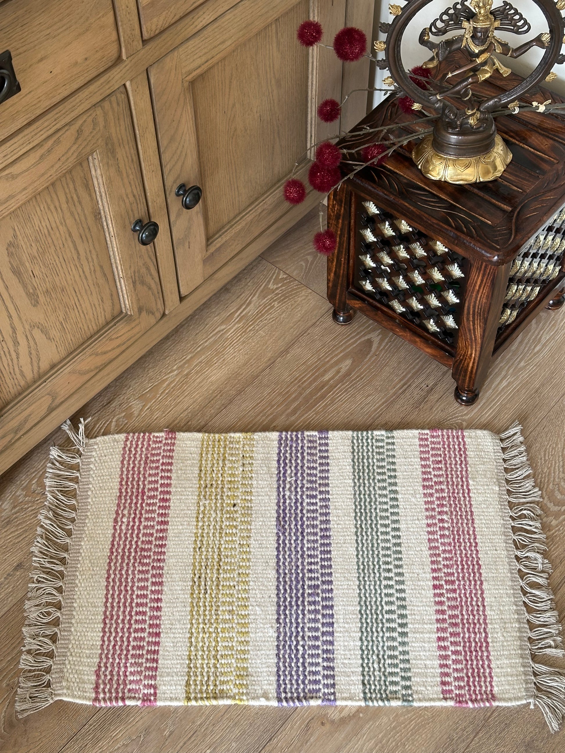 White cotton rug with colourful checked design