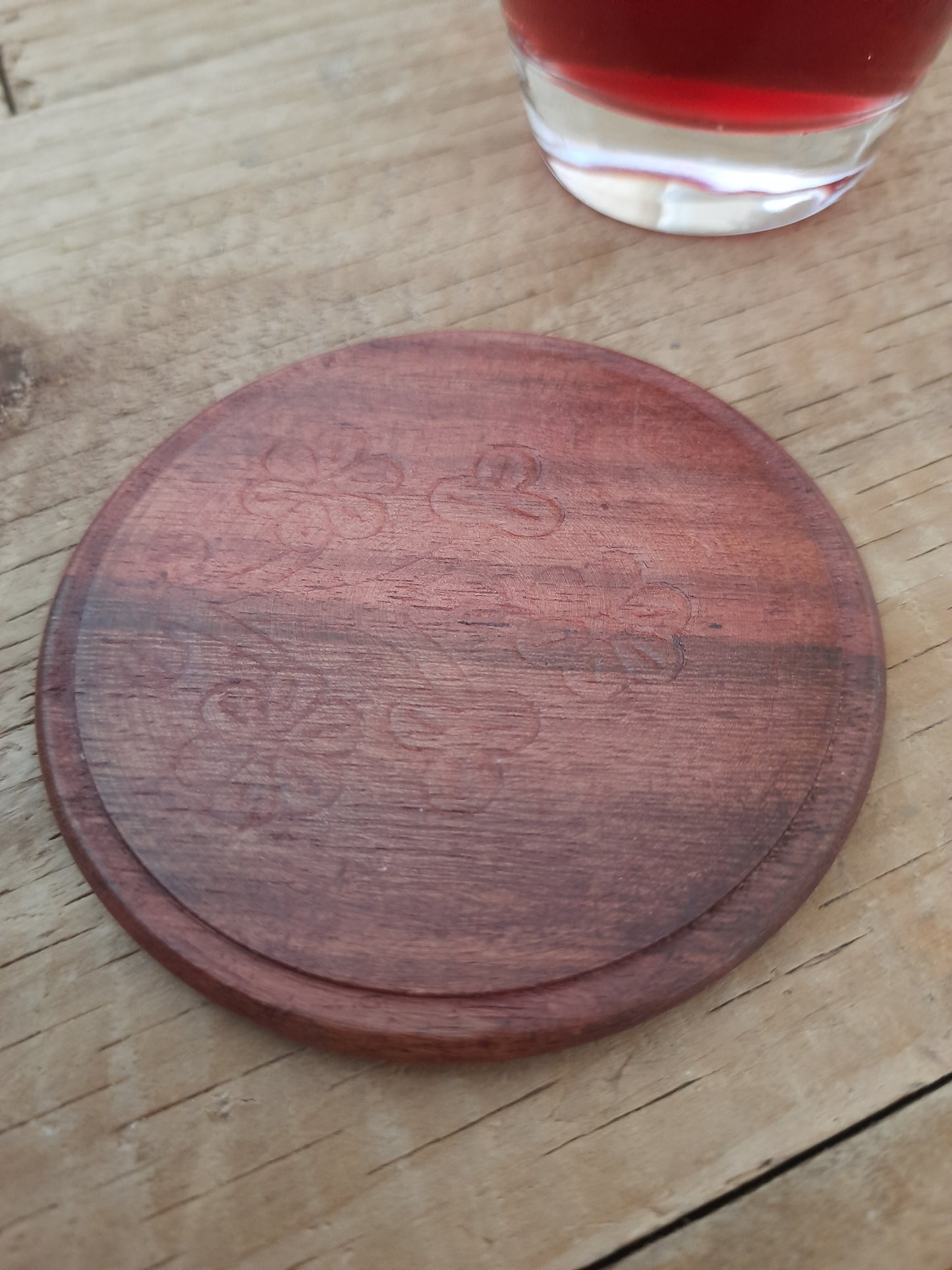 Close-up of a rosewood drink coaster with natural grain