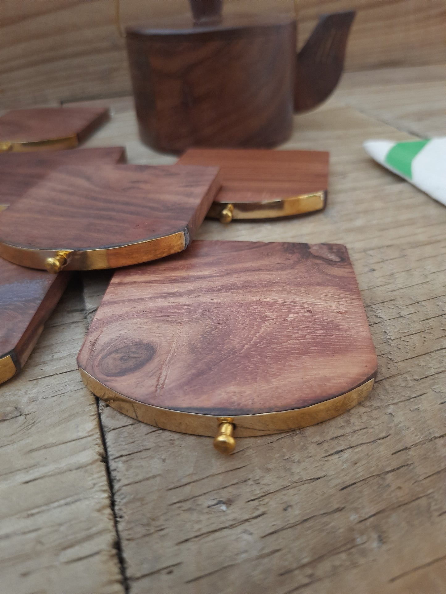 Handcrafted rosewood coasters from India