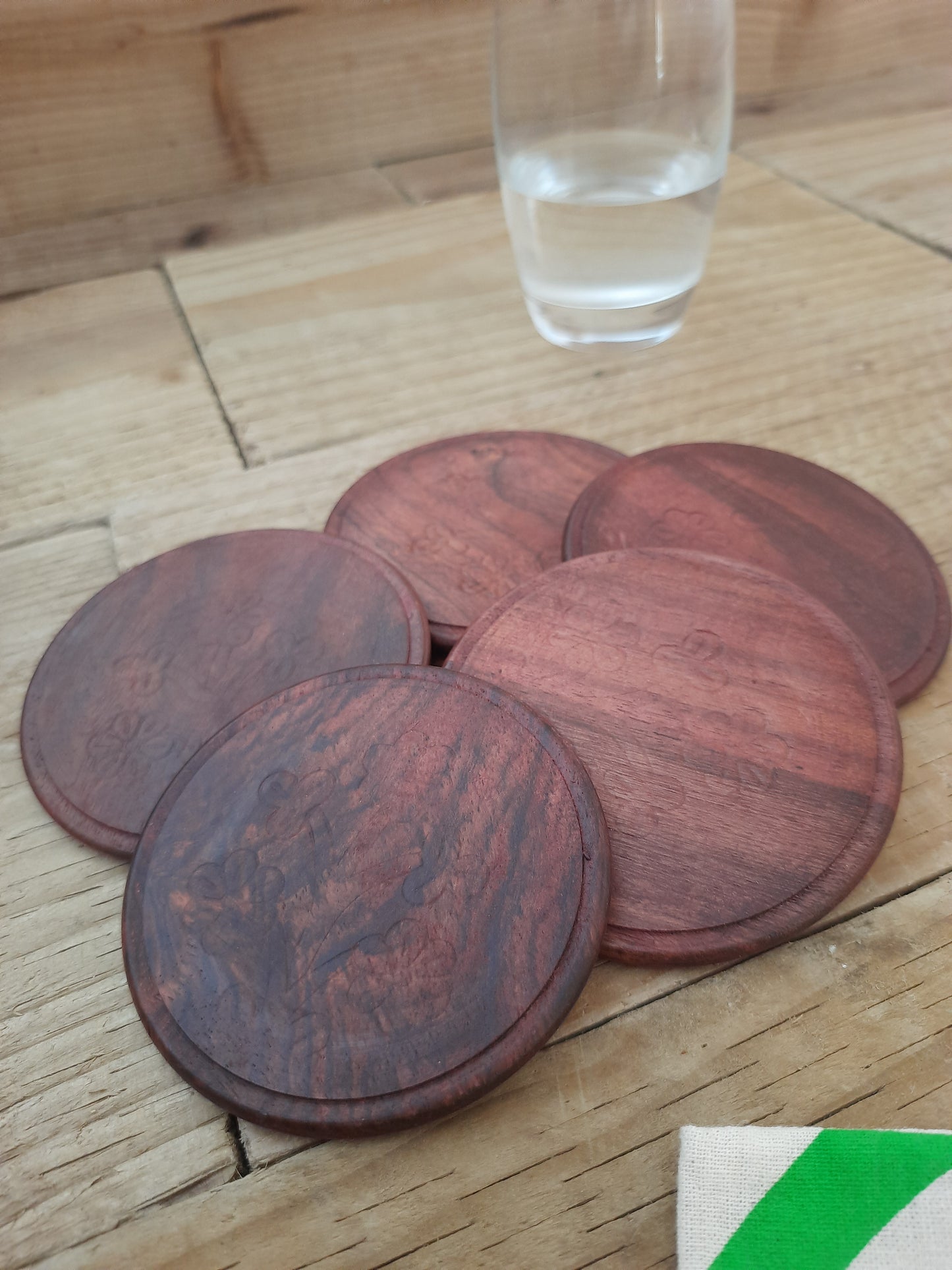 Rosewood coaster set arranged on a dining table