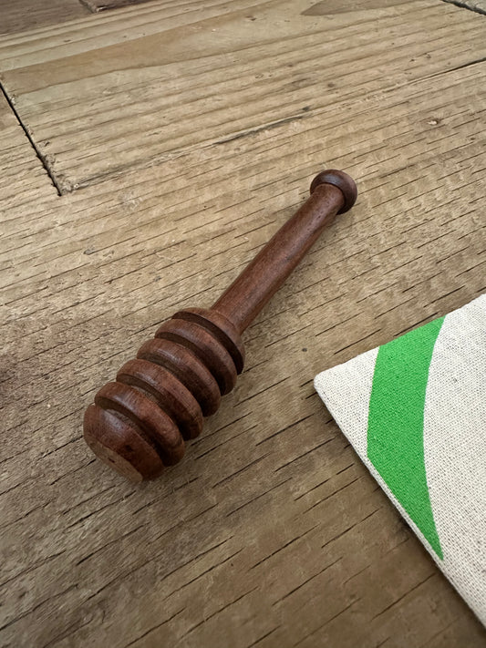 Rosewood honey dipper stick in a natural brown finish