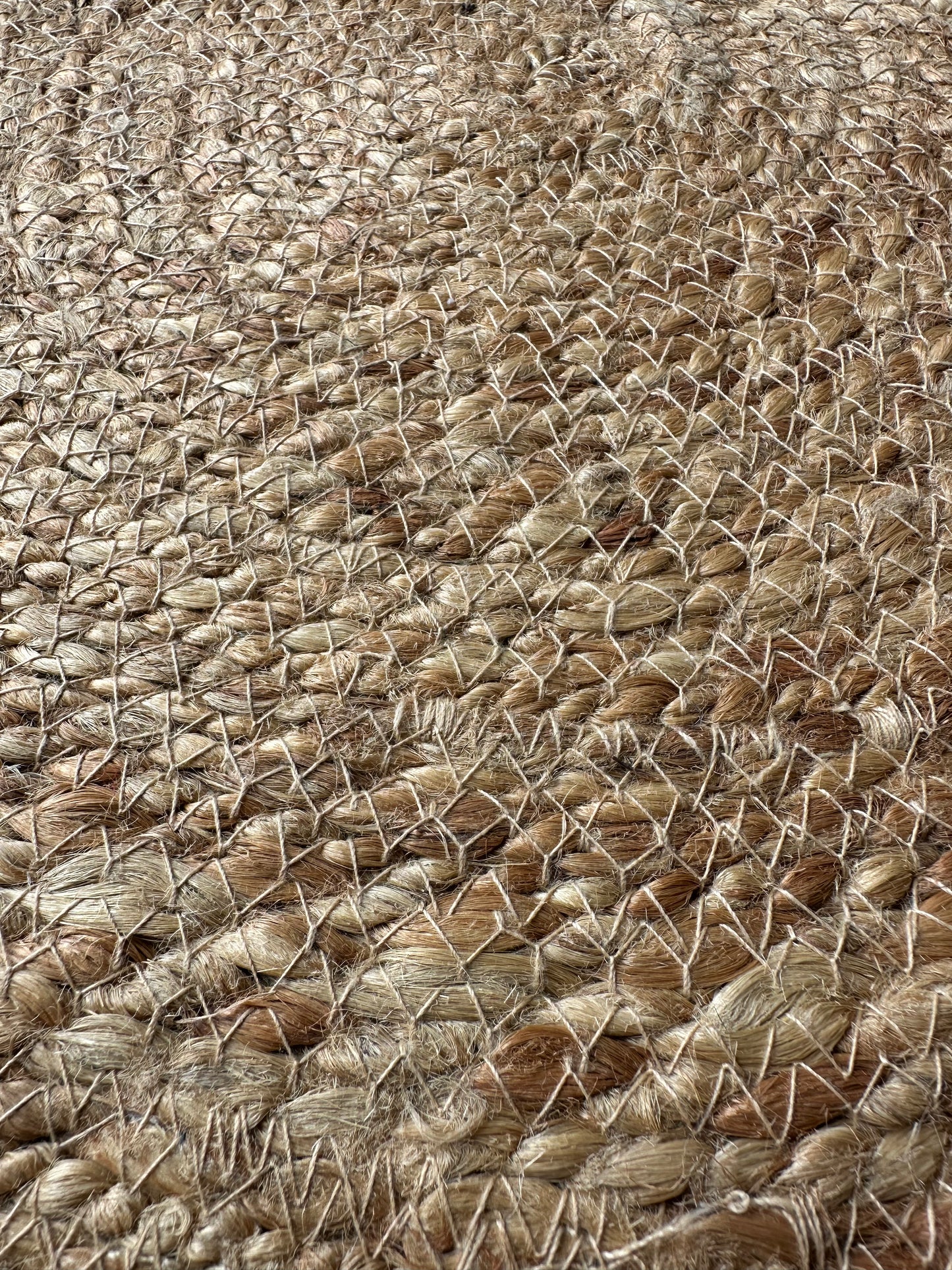 Round beige jute rug as a housewarming gift