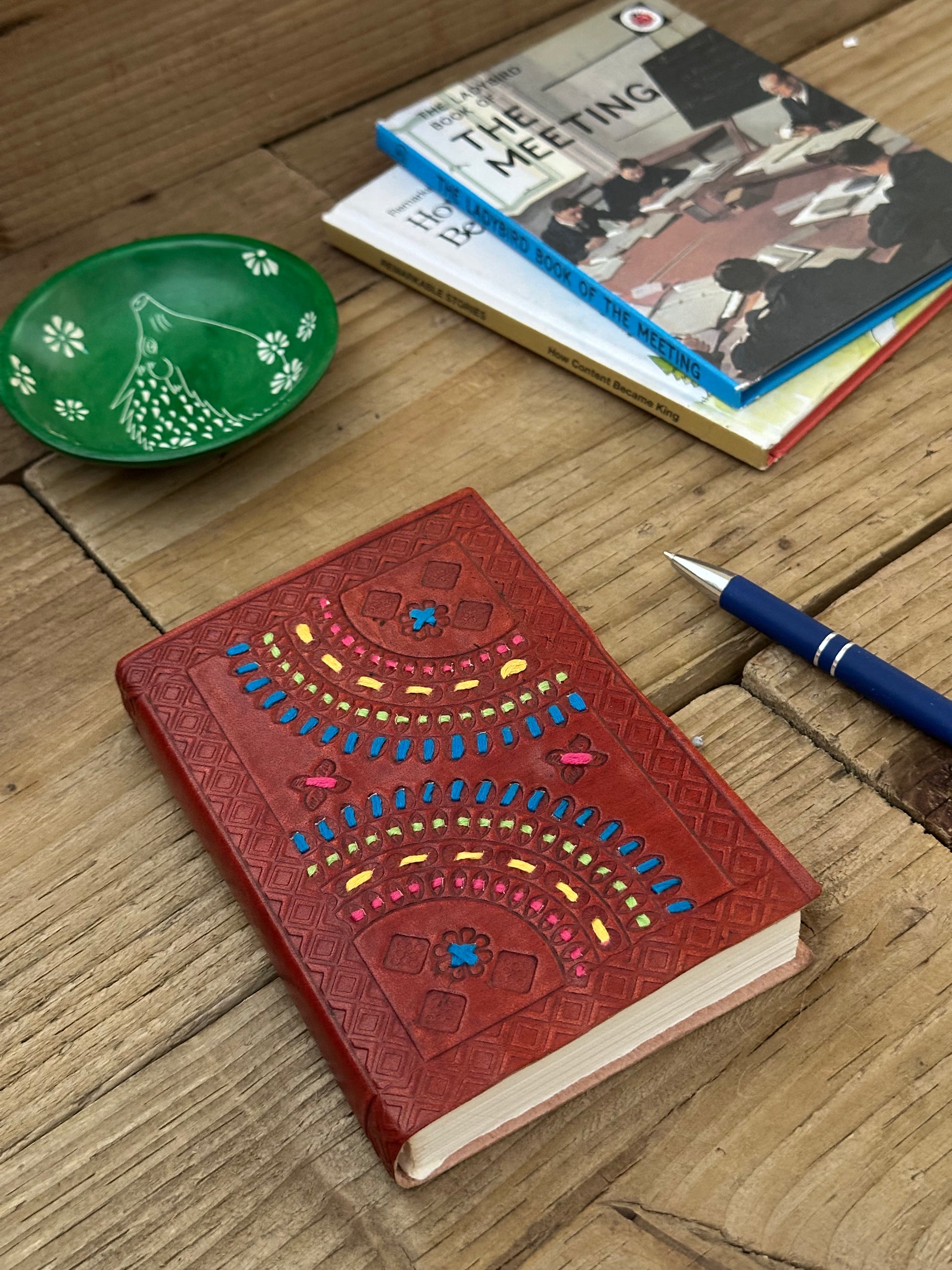Small leather-bound notebook with embossed geometric design