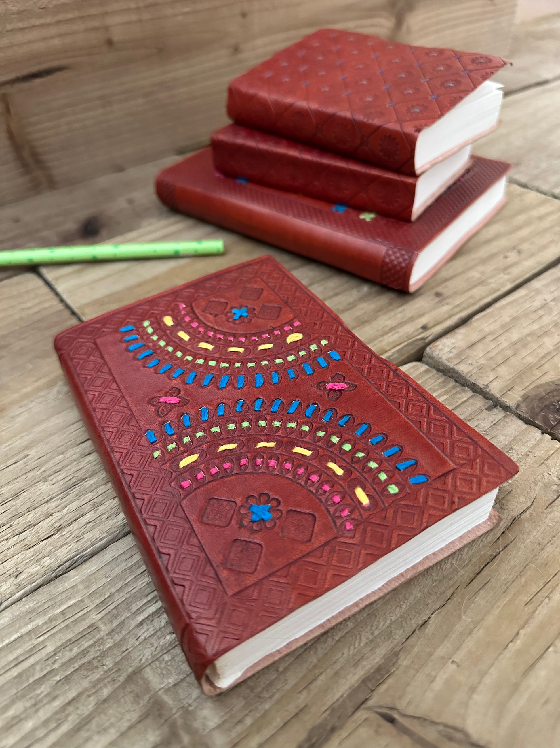 Small leather-bound notebook with embroidered cover