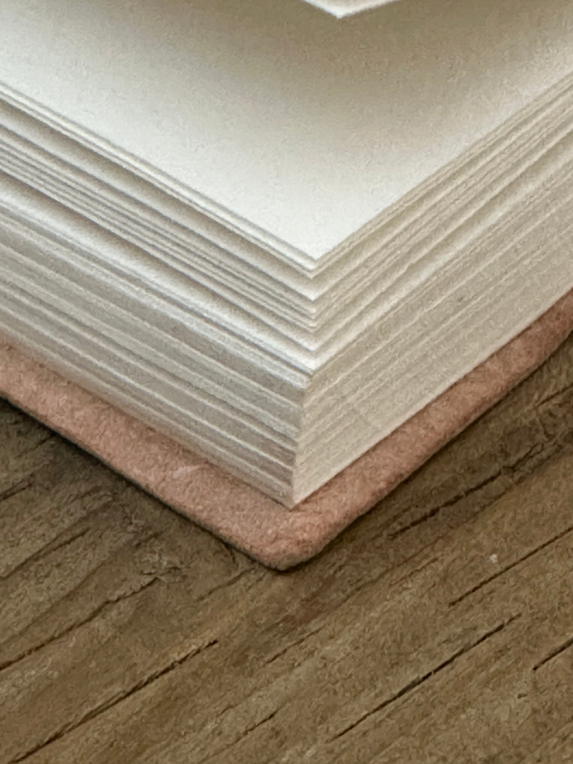 Small leather-bound notebook open to show recycled cotton paper