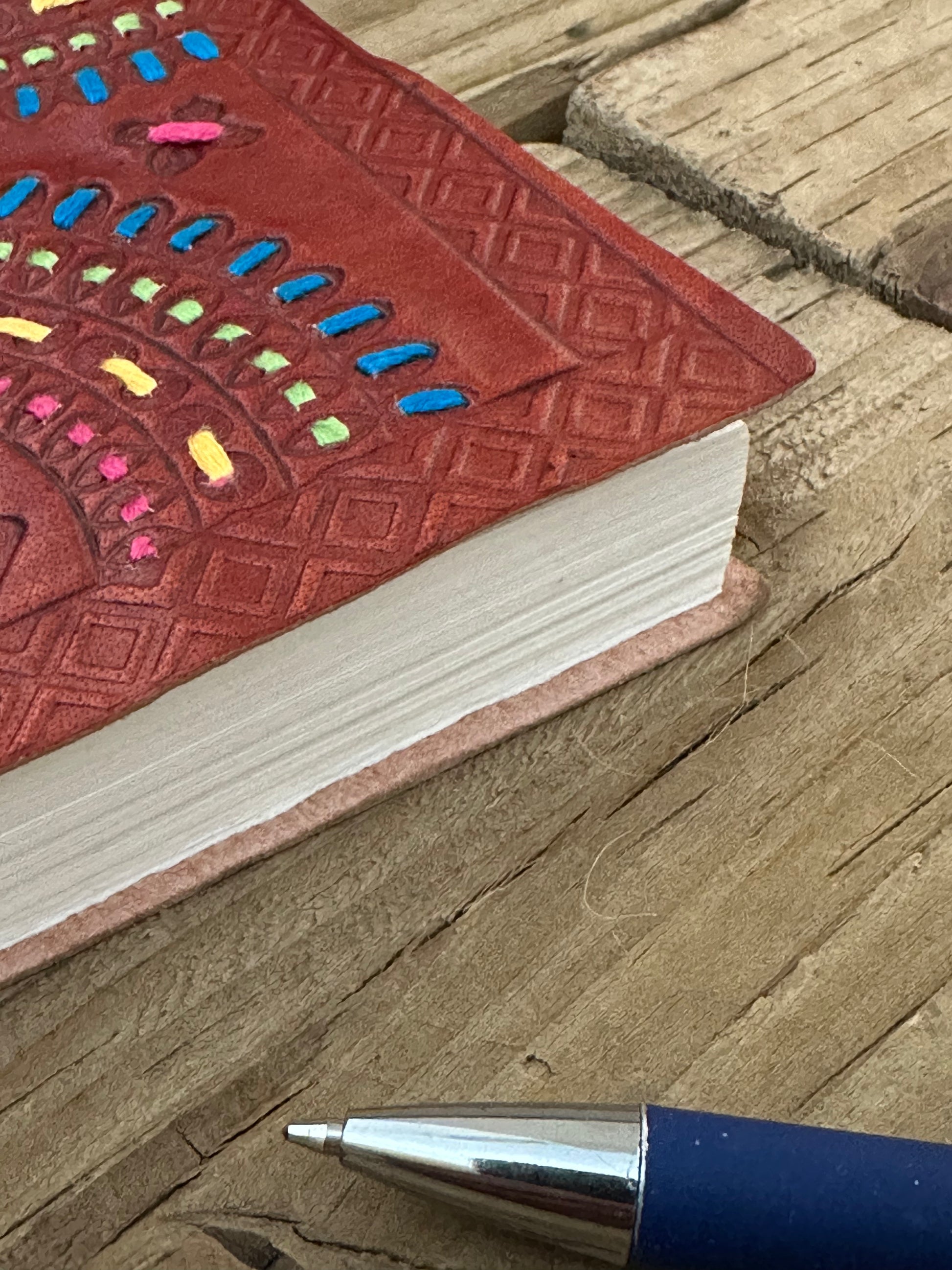 Small leather-bound notebook showing embossed geometric detailing