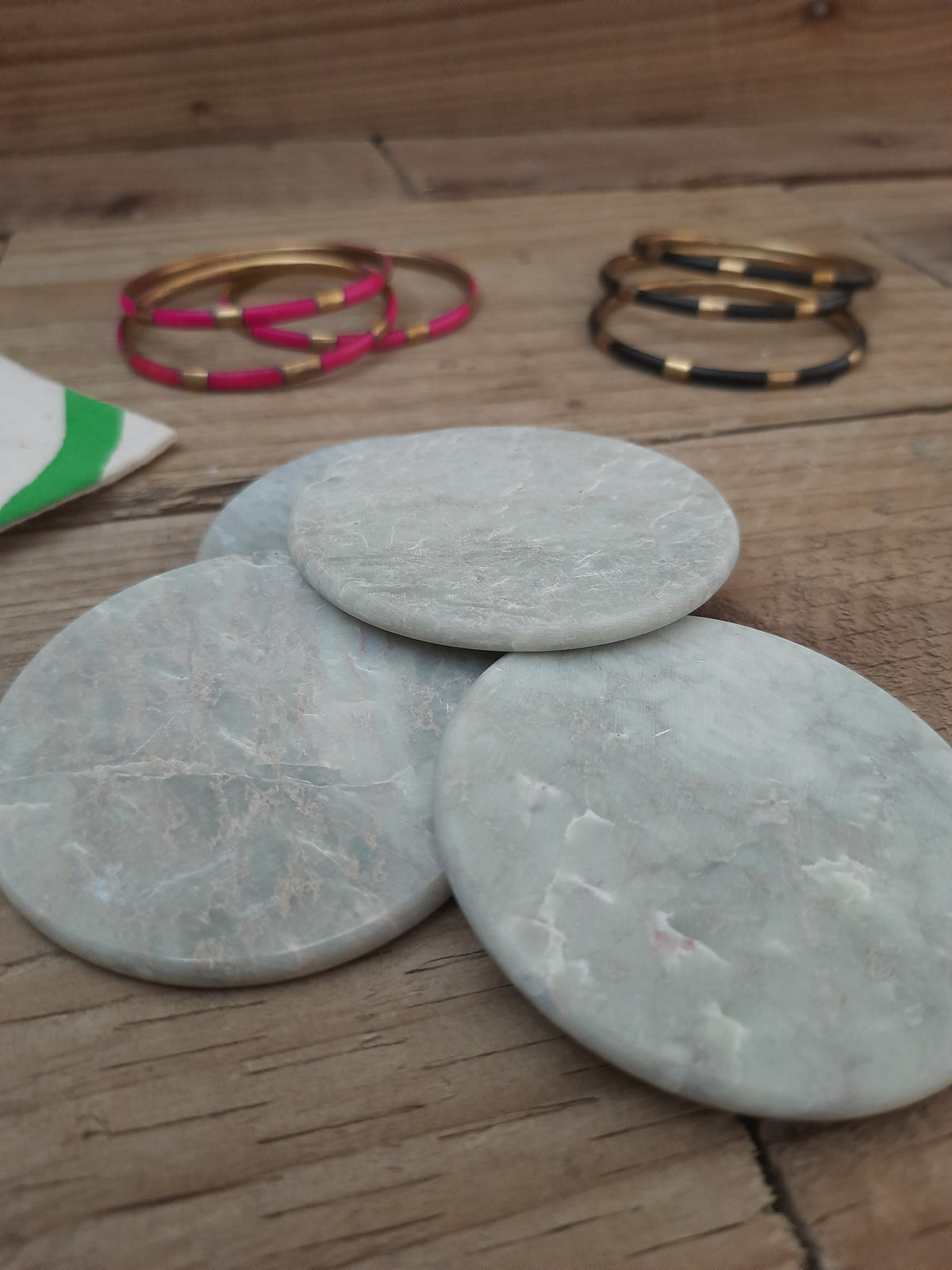 Close-up of hand carved detail on natural stone coaster