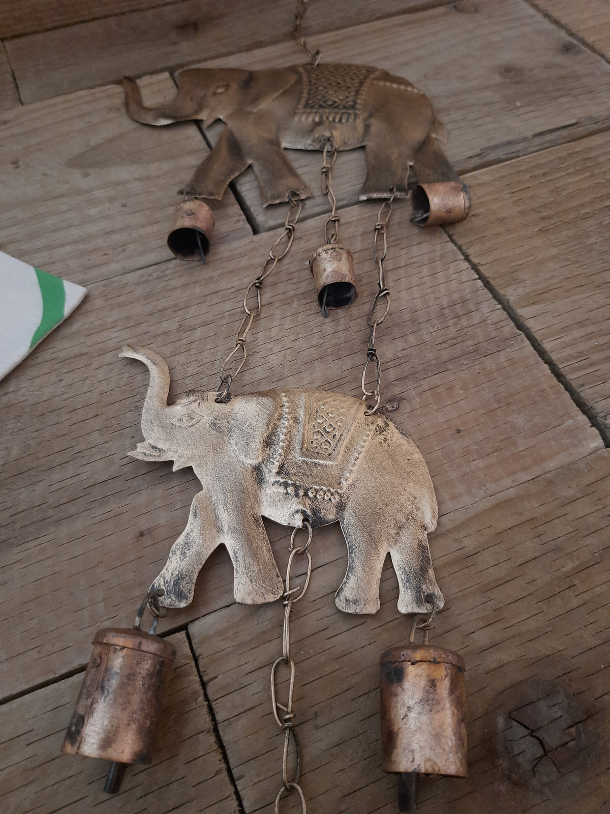 Two elephant wind chime hanging as an outdoor decoration