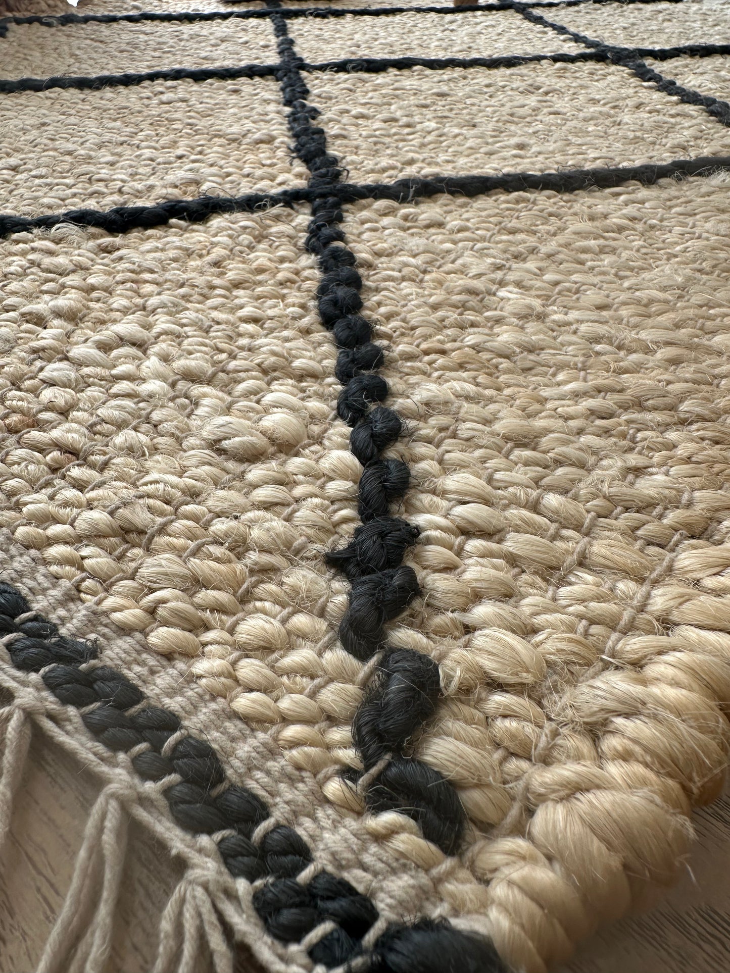 Close-up of handmade white jute rug texture