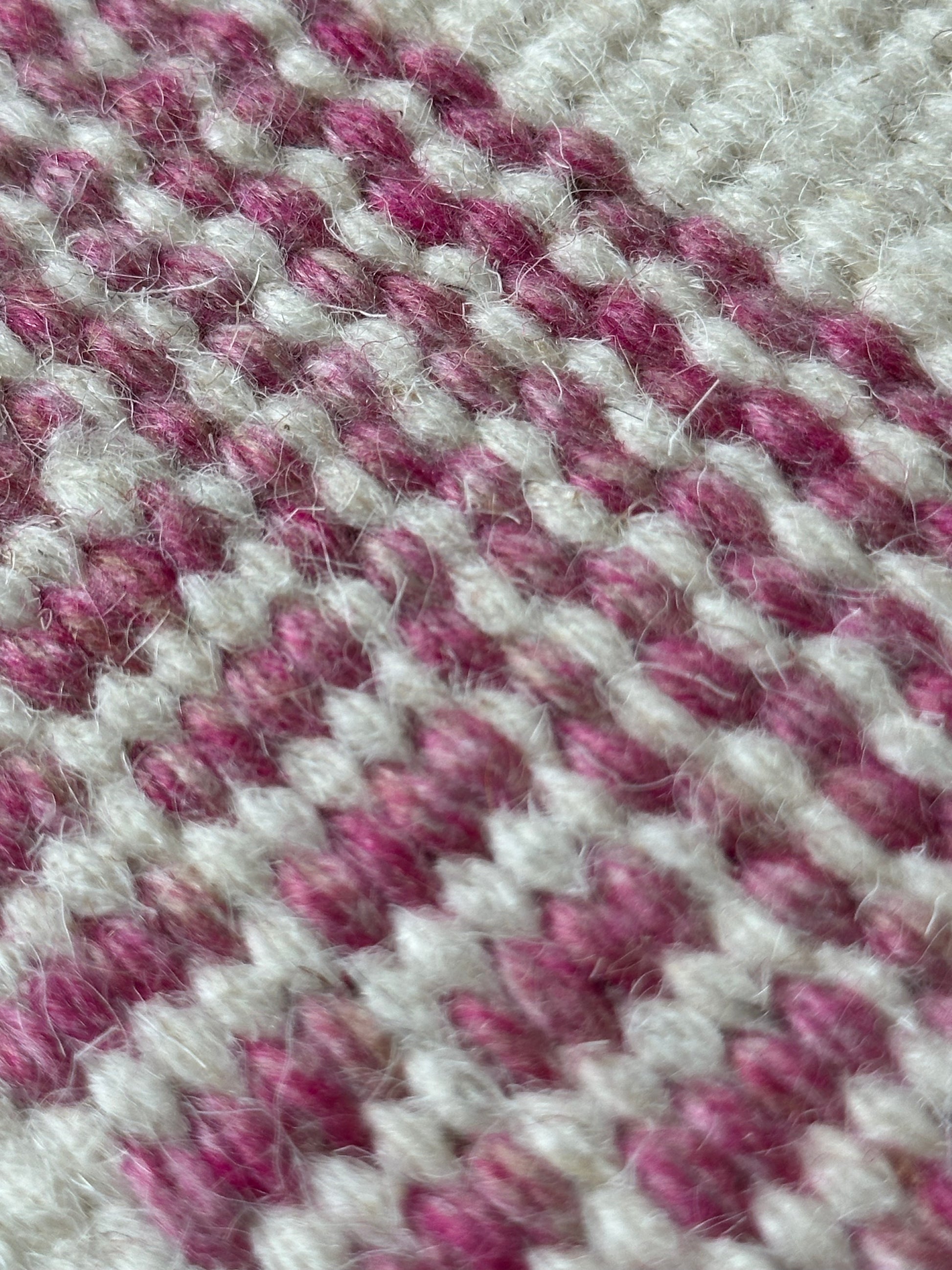 Close-up of red green blue and yellow rug detail