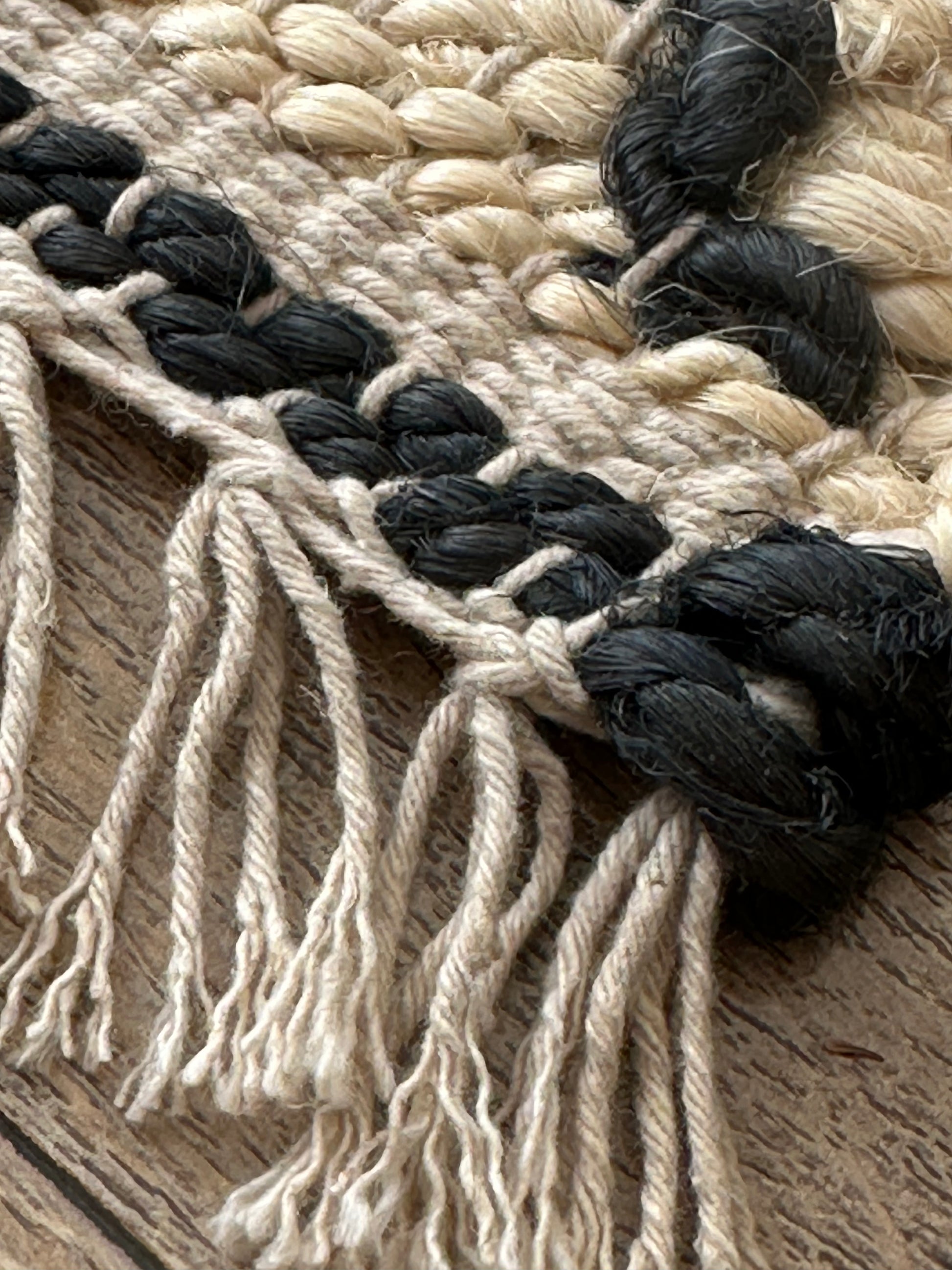 White jute rug with contrasting black geometric pattern