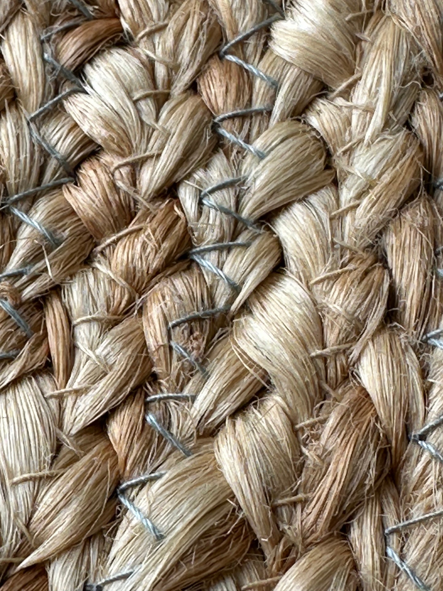 Detailed view of woven jute texture and coloured design